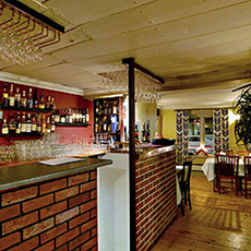 Baren som är bygd med tegelstenar hos Restaurang Bellman. Foto: Pressbild Baren som är bygd med tegelstenar hos Restaurang Bellman. Foto: Pressbild